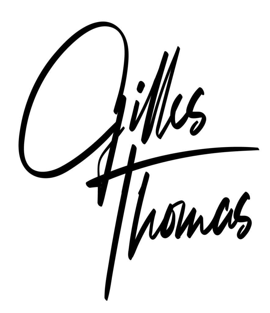 Logo signature officiel du photographe animalier Gilles Thomas.